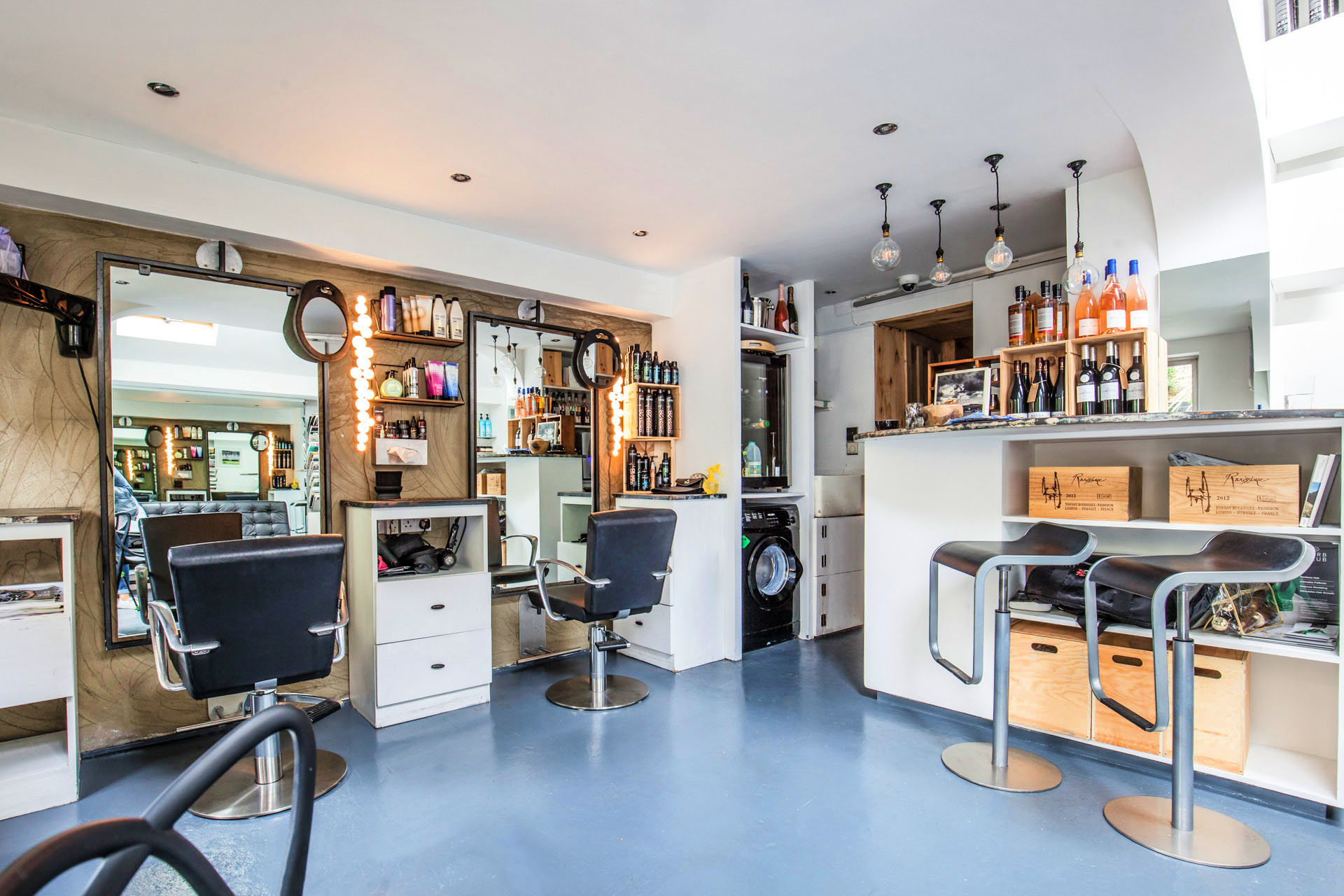 Wide view of the styling room and wine counter